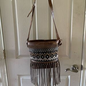 P &G western Brown faux leather crossbody bag stitch,tassels & studs accents .